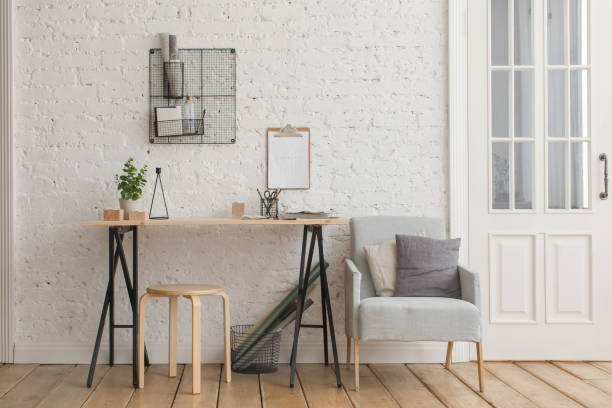 istock Desk with stationery in the white interior Loft 936384260
