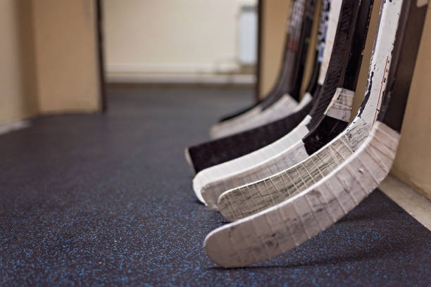 Hockey sticks in locker rooms before the game