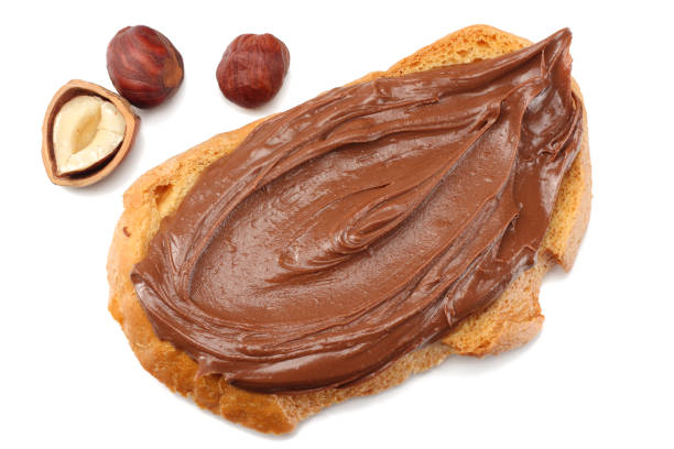 istock Slice of bread with chocolate cream with hazelnut isolated on white background 936387738