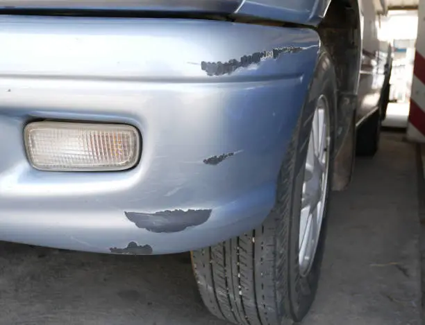 Photo of Abrasion, front of car.