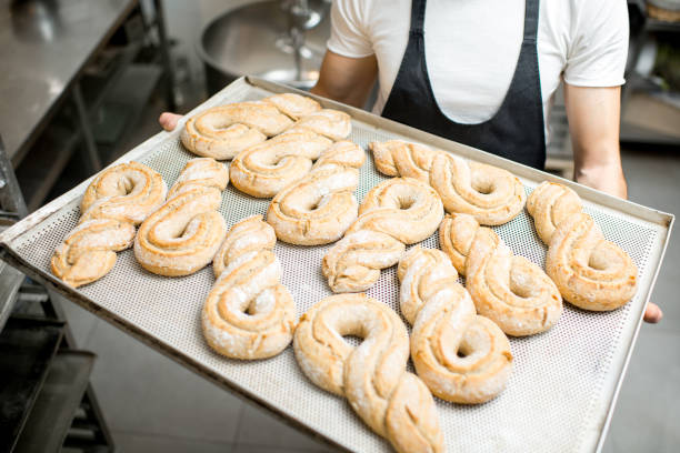 istock Baker with tray full of sweet pastry 936389712