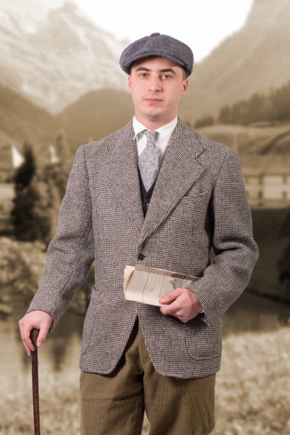 istock young man in vintage clothes with a hat, 1940 style 936390096