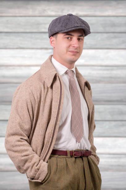 istock young man in vintage clothes with a hat, 1940 style 936390098
