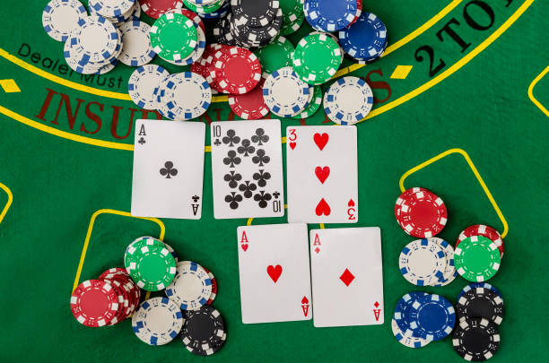 istock playing cards and casino poker chips on green 936390390