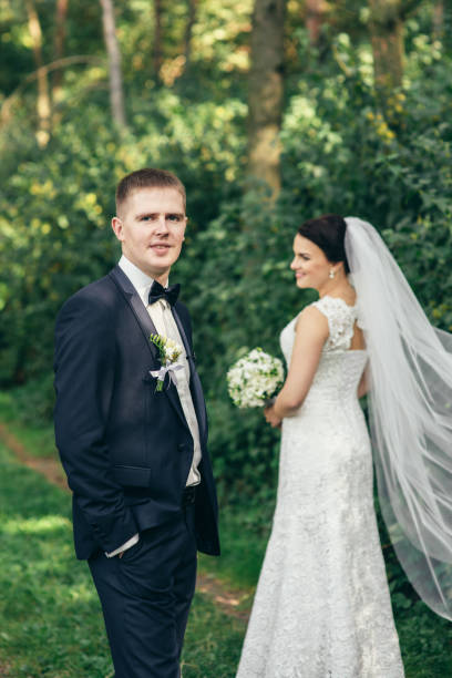 istock Happy bride on a walk in the park 936390776