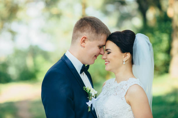 istock Happy bride on a walk in the park 936390838