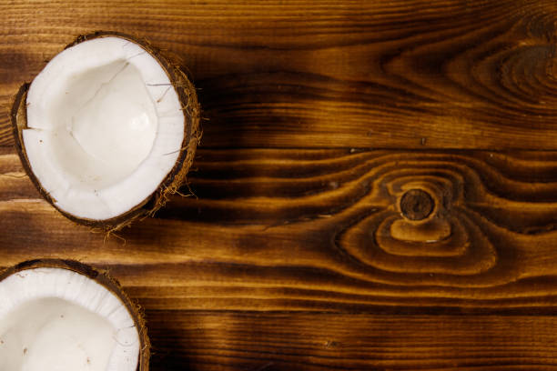istock Fresh ripe coconut on rustic wooden table 936391092