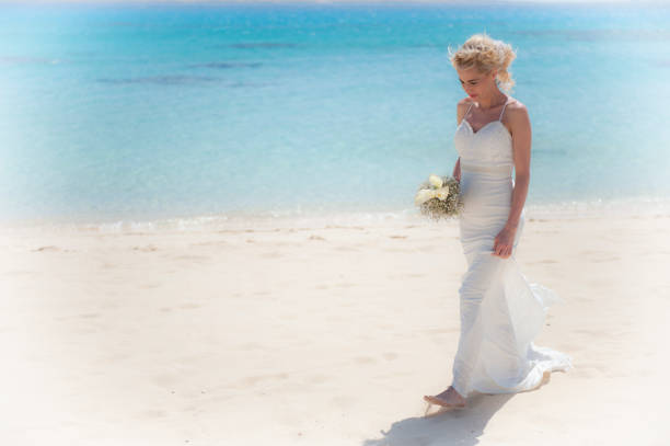 istock Beautiful bride on a tropical beach wedding day 936391730