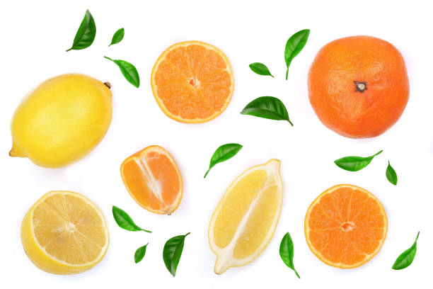 istock lemon and tangerine with leaves isolated on white background. Flat lay, top view. Fruit composition 936391886