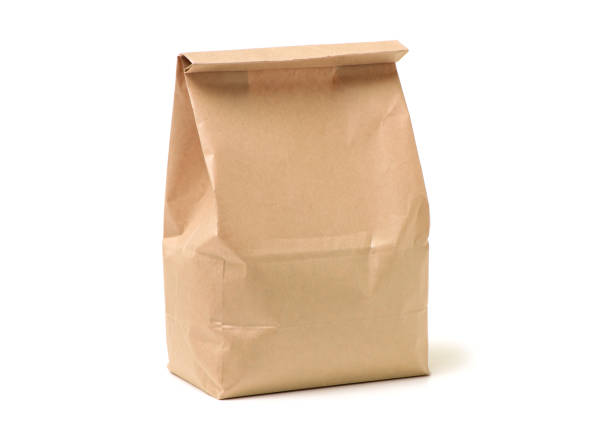 обед мешок на белом фоне - paper bag bag paper brown стоковые фото и изображения