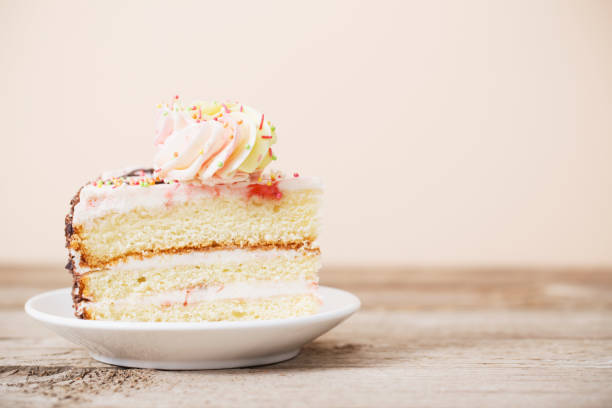 istock piece of cake on a wooden table 936393736