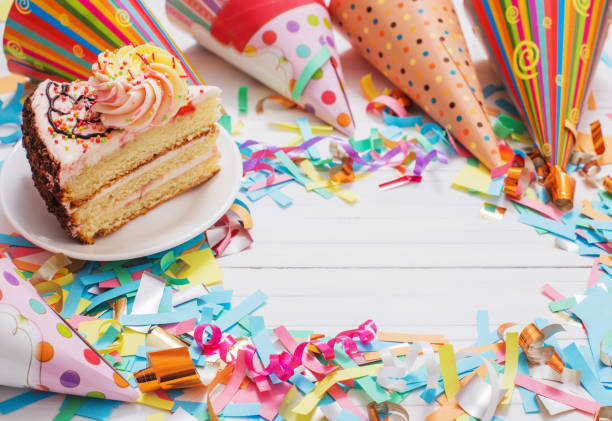 istock birthday cake and  decoration on white wooden background 936393742