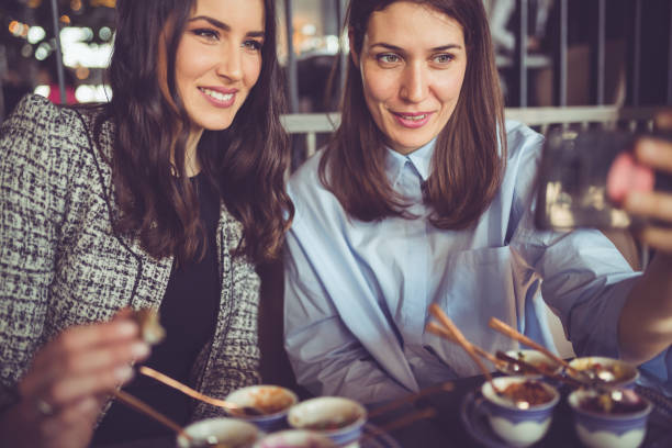 istock Coworkers making selfie during business lunch 936394942
