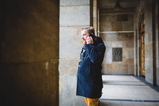 istock Young businessman using mobile phone outdoors 936397642