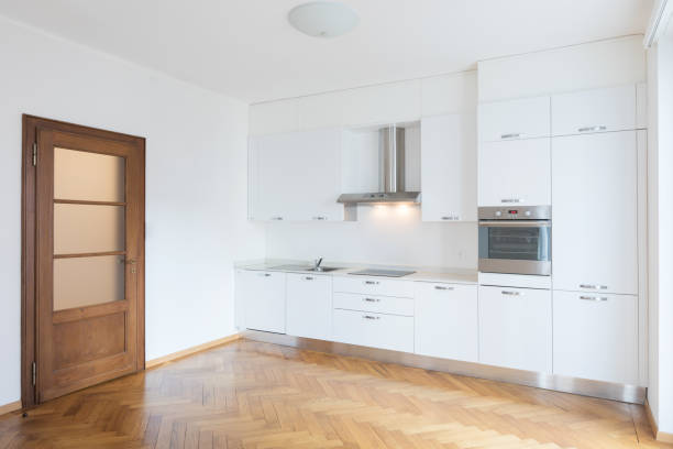 istock Kitchen in newly renovated open space with wooden floors 936399010
