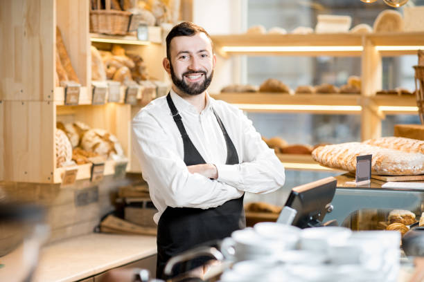 istock Seller in the bread store 936399774