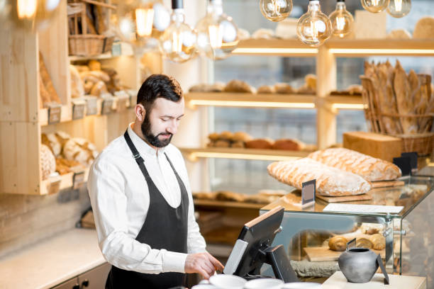 istock Seller in the bread store 936399928