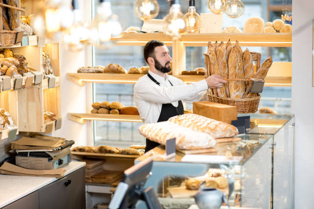 istock Seller in the bread store 936399982