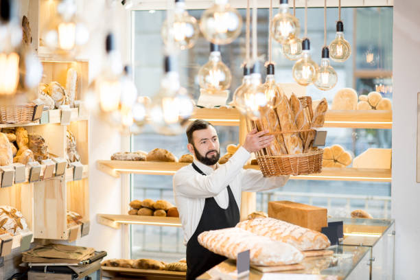 istock Seller in the bread store 936400016