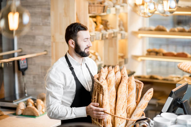 istock Seller in the bread store 936400088