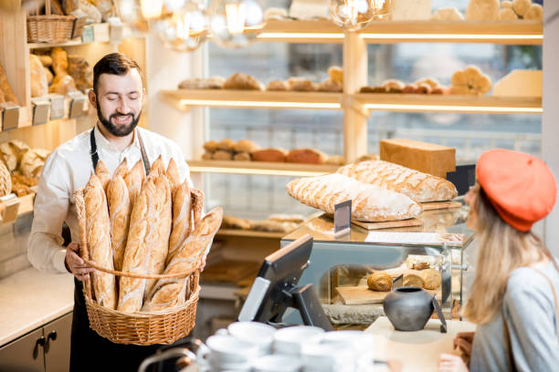 istock Seller in the bread store 936400140