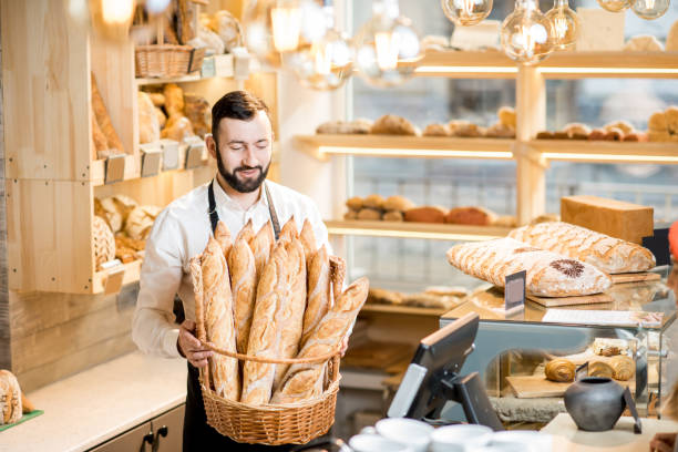 istock Seller in the bread store 936400178