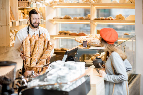 Buying a baguette in the bakery store