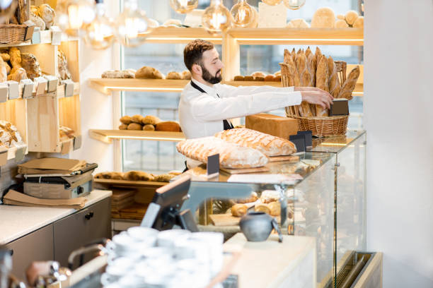 istock Seller in the bread store 936400324