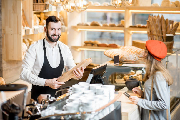 istock Buying a baguette in the bakery store 936400364