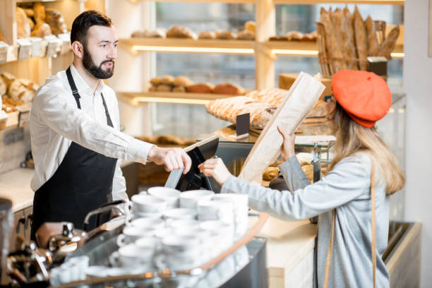 istock Buying a baguette in the bakery store 936400480