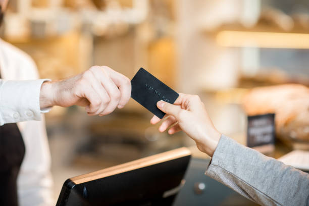 Paying by credit card in the store with bakery products