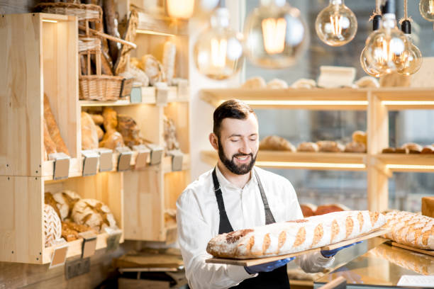istock Seller in the bread store 936400576