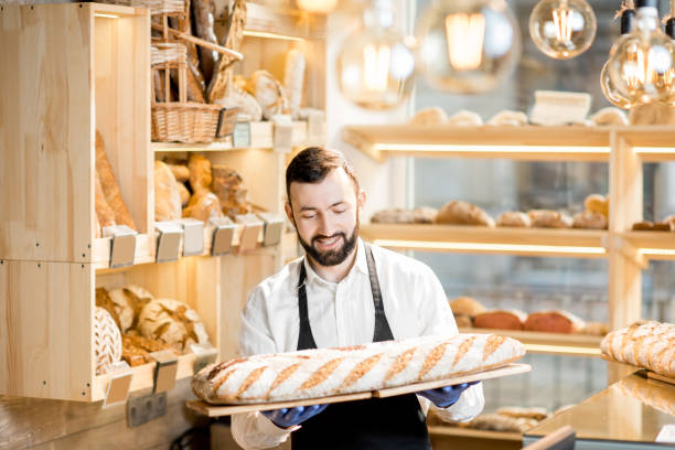 istock Seller in the bread store 936400620