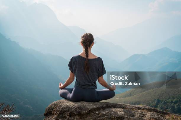 Woman Meditates In Yoga Asana Padmasana Stock Photo - Download Image Now - Meditating, Zen-like, Yoga