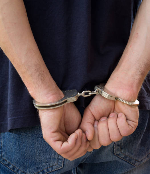 istock Adult male arrested and handcuffed 936402626