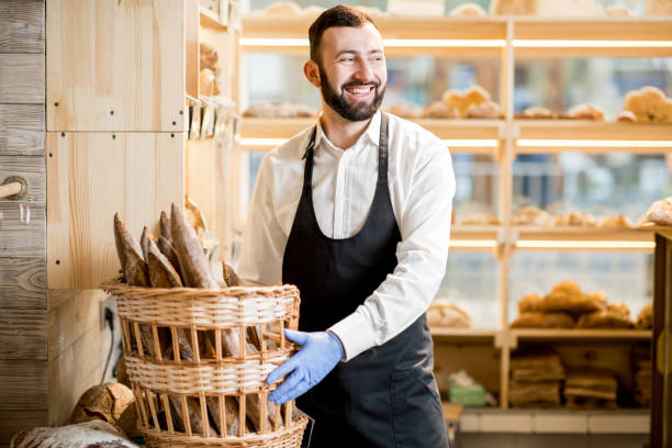 istock Seller in the bread store 936402778