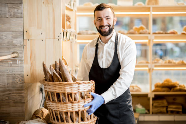 istock Seller in the bread store 936402802