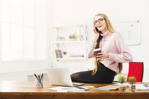 istock Business woman talking on phone at office 936403680