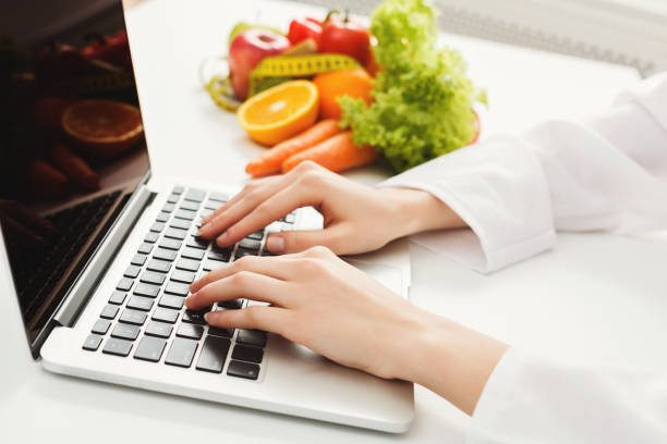 istock Female nutritionist working on laptop 936403912