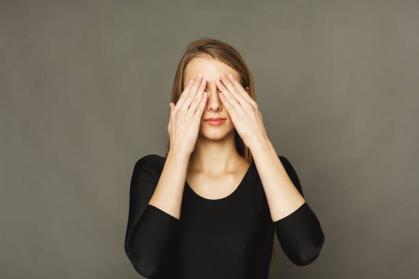 istock Confused woman puts her hands on eyes 936404186