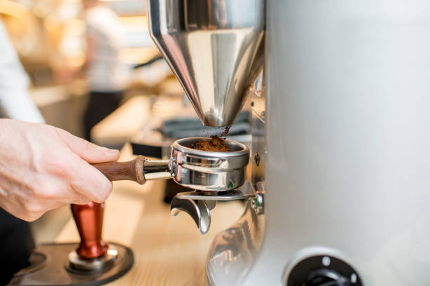 istock Grinding a coffee into the handle of the coffee machine 936404522