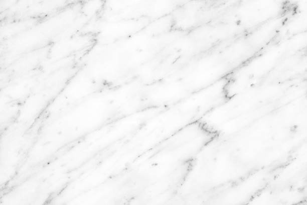 istock White Carrara Marble natural light surface for bathroom or kitchen countertop 936404638