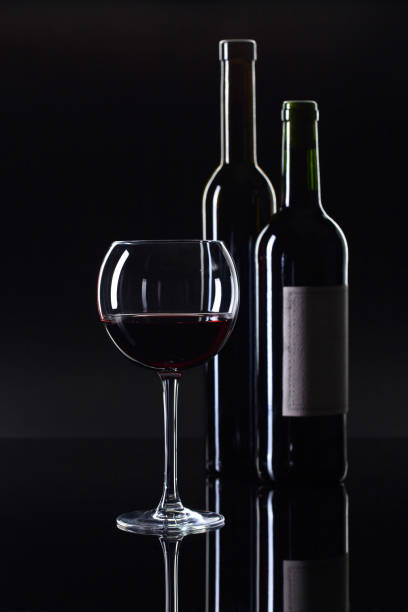 istock Bottles and glass of red wine . 936404844