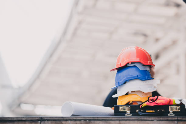 istock Hard safety helmet hat for safety project of workman as engineer or worker on concrete floor. 936405356