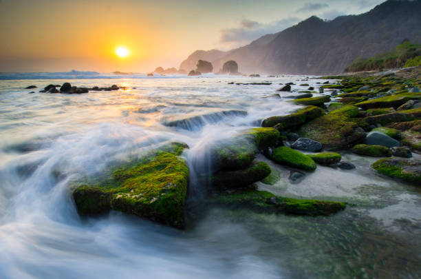 istock Sunset at Tanjung Papuma Beach, Jember, Indonesia 936406526