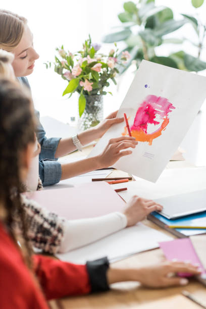 istock fashionable magazine editors working with sketch in modern office 936408048