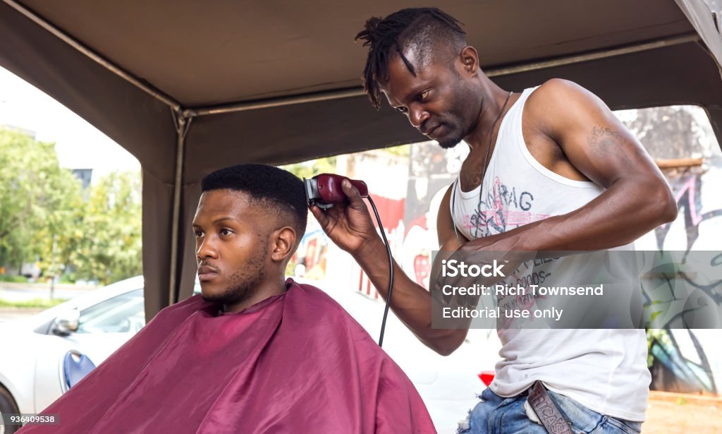Man Having Haircut In An Informal Barber Shop Stock Photo - Download Image  Now - African Ethnicity, Hair Salon, Africa - iStock