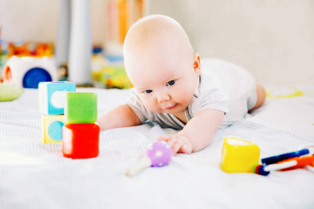 istock Smiling cutest baby playing with colorful toys. 936410936