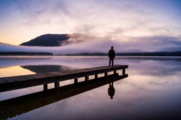 istock Contemplation At Lake Kaniere 936411688