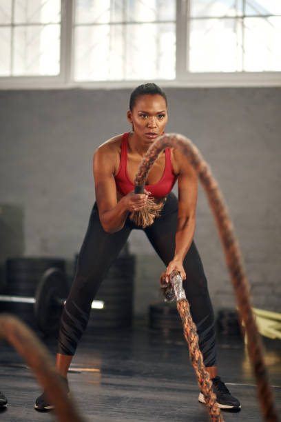 istock Woman working out with ropes 936412776